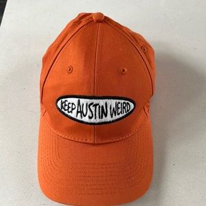 Keep Austin Weird burnt orange (UT color) youth ball cap. Velcro strap.